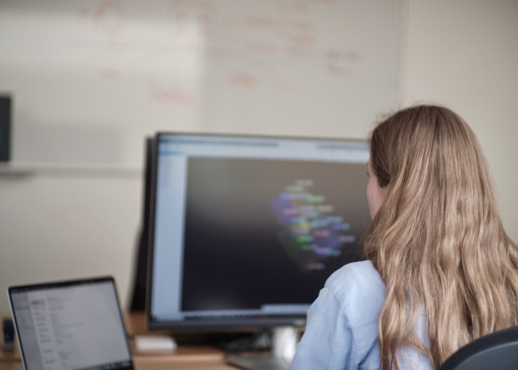 Technician reviewing a three-dimensional building model on screen